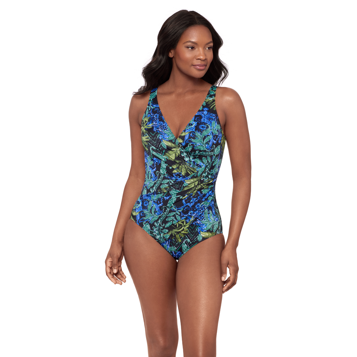 Woman wearing a blue and green patterned one-piece swimsuit on a white background