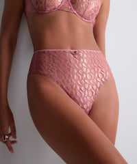 Pink lingerie set on a neutral background