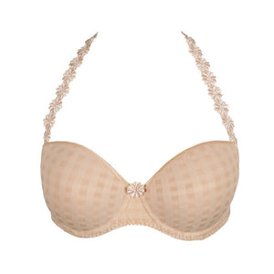 Beige bra with floral lace straps on a white background