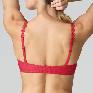 Red bra with floral lace details on a plain background