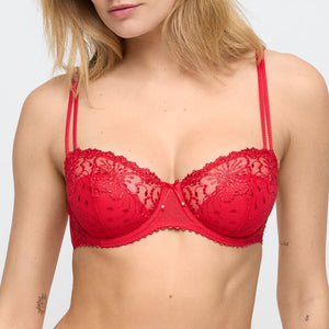 Red lace bra worn by a model on a white background
